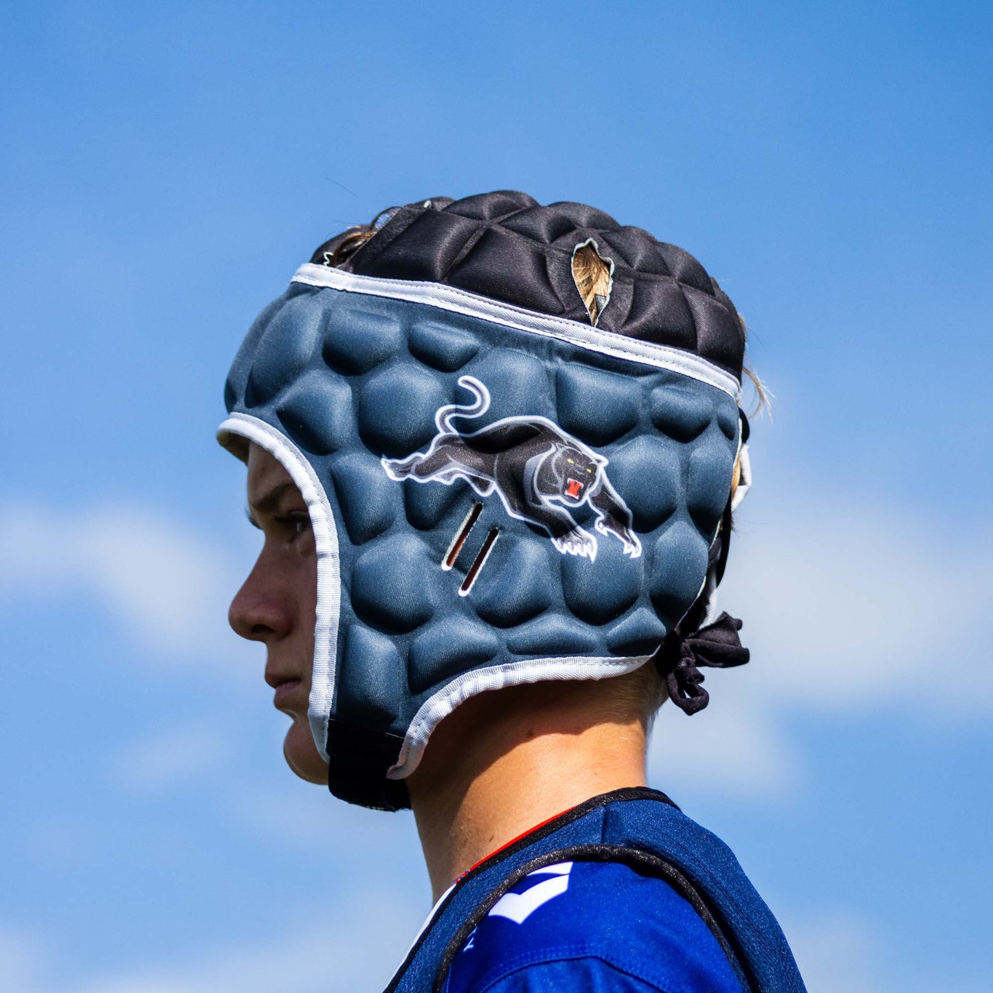 Official NRL Headgear, Penrith Panthers, lifestyle image, side.