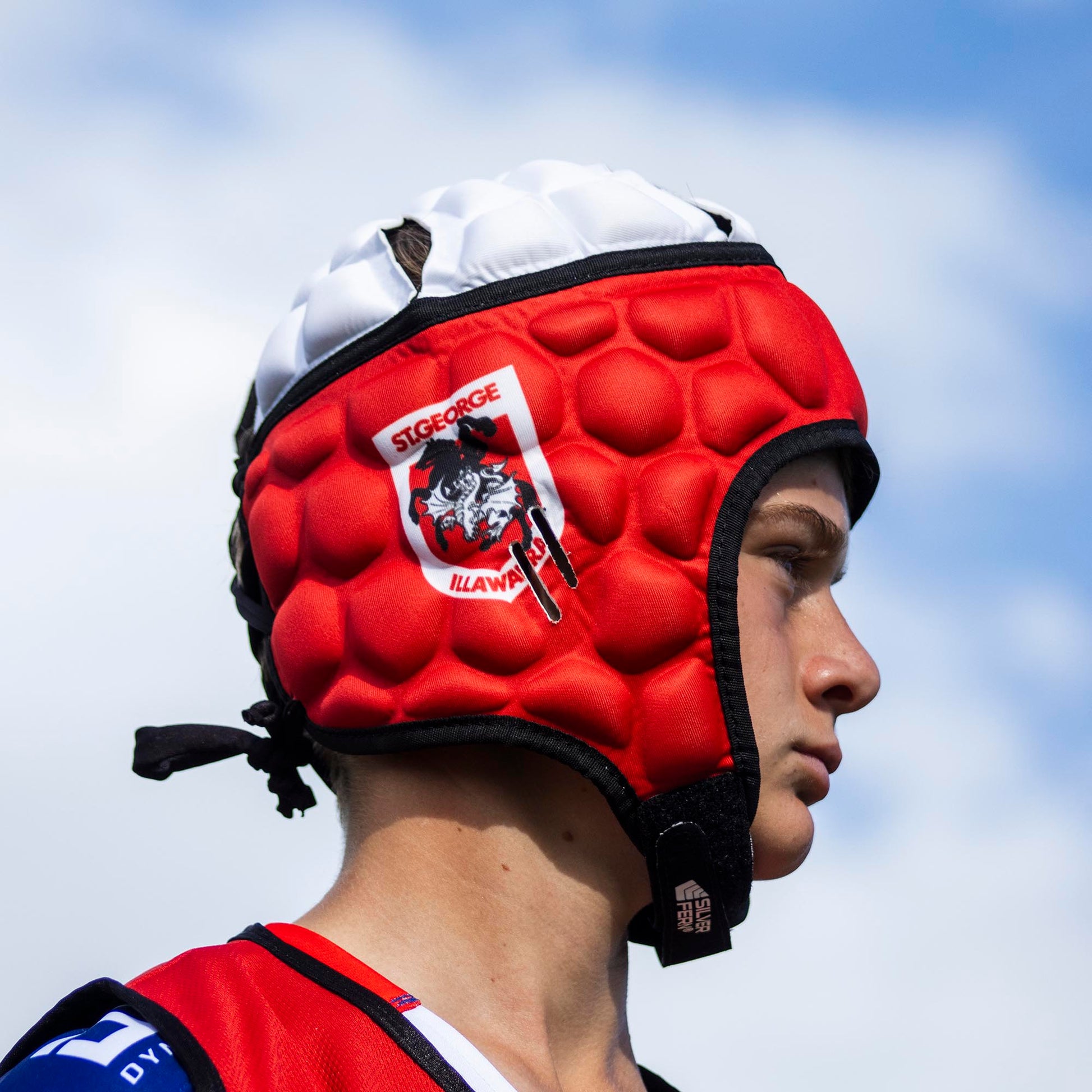 Official NRL Headgear, St. George Illawarra Dragons, lifestyle image, side.