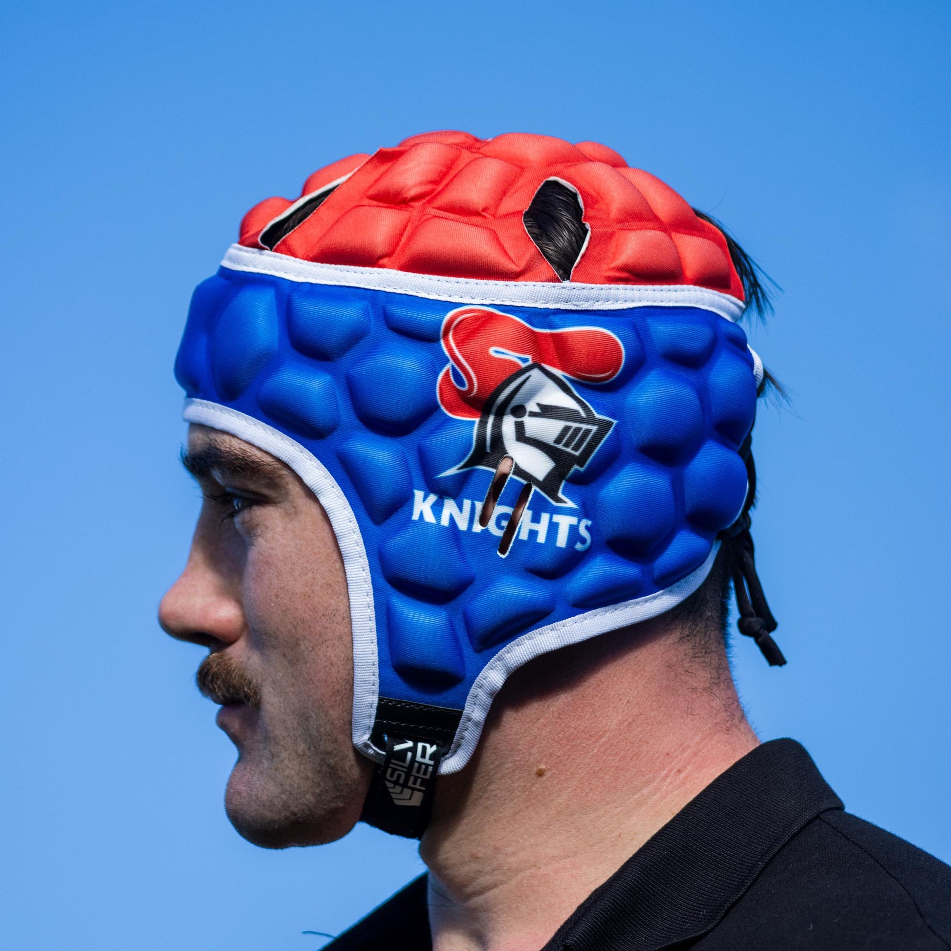 Official NRL Headgear, Newcastle Knights, lifestyle image, side.