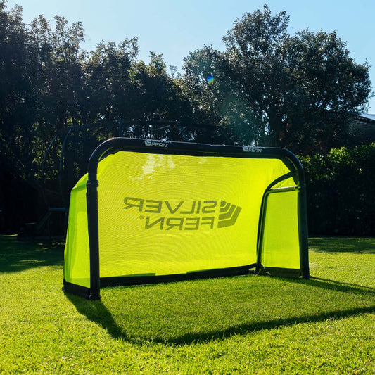 Silver Fern Soccer Goal, lifestyle shot, goal sitting on a backyard.