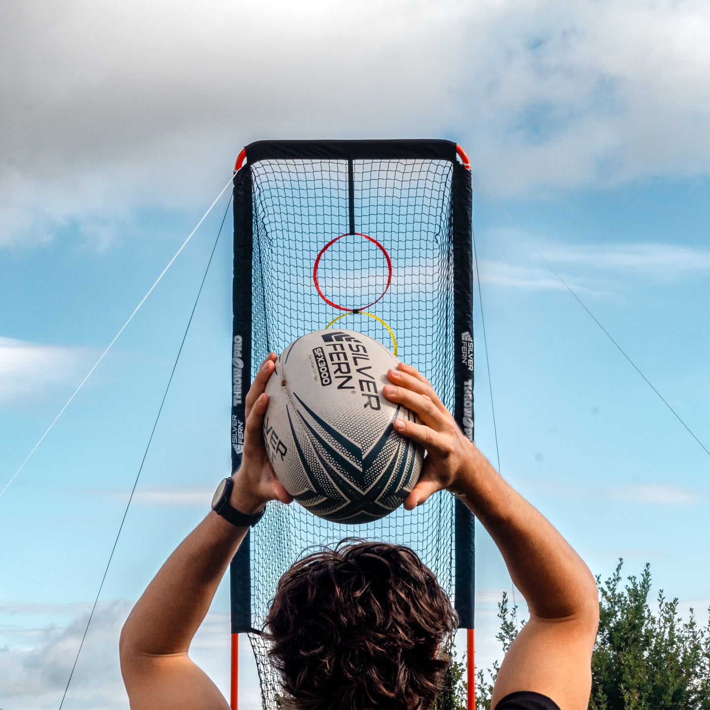 ThrowPro Lineout Throwing Net, player throwing ball at the net, lifestyle shot.